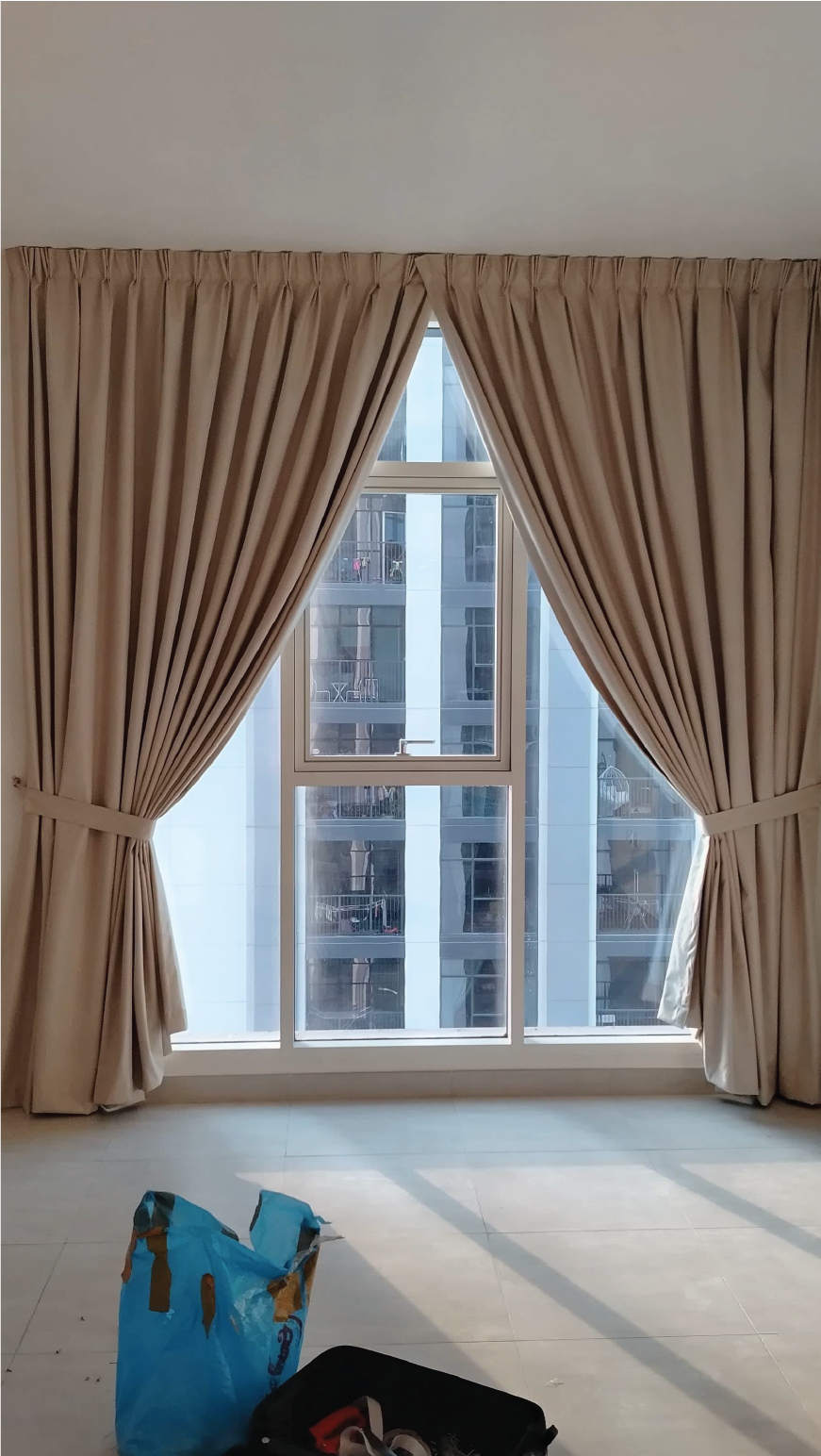 Elegant Beige Curtains in a Bright Corner Room