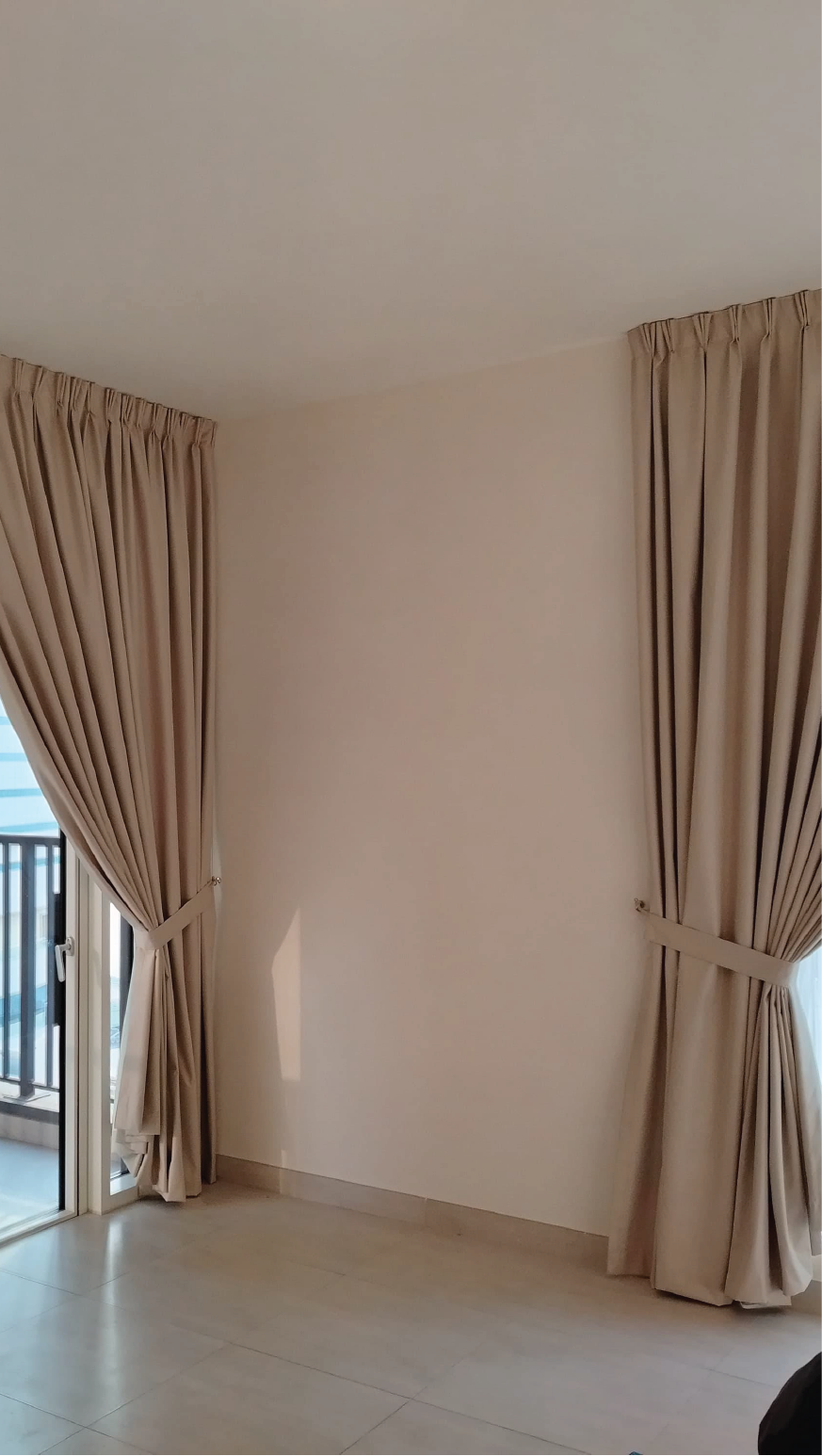 Elegant Beige Curtains in a Bright Corner Room